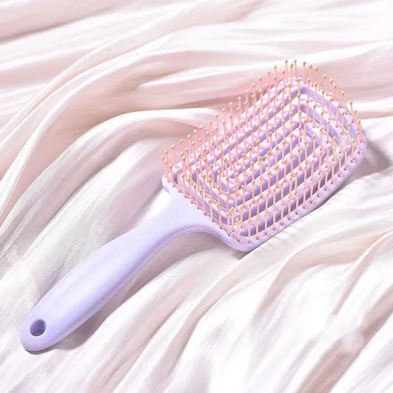 Elastic Hollow-Out Scalp Massage Comb & Styling Brush – Designed to gently stimulate the scalp while effectively detangling hair, this versatile tool speeds up blow drying for a smooth, effortless style.