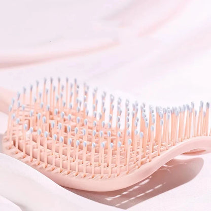 Elastic Hollow-Out Scalp Massage Comb & Styling Brush – Designed to gently stimulate the scalp while effectively detangling hair, this versatile tool speeds up blow drying for a smooth, effortless style.